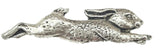 Detailed pewter running hare pin badge with butterfly clutch fastening on a white background.