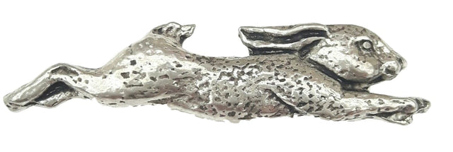 Detailed pewter running hare pin badge with butterfly clutch fastening on a white background.