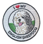 Round embroidered patch featuring an English Sheepdog with the text "I Love My English Sheepdog", black stitched border and white background, suitable for iron-on or sew-on application.