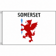 Somerset old county flag with red wyvern holding blue staff and SOMERSET lettering on white, 5ft x 3ft
