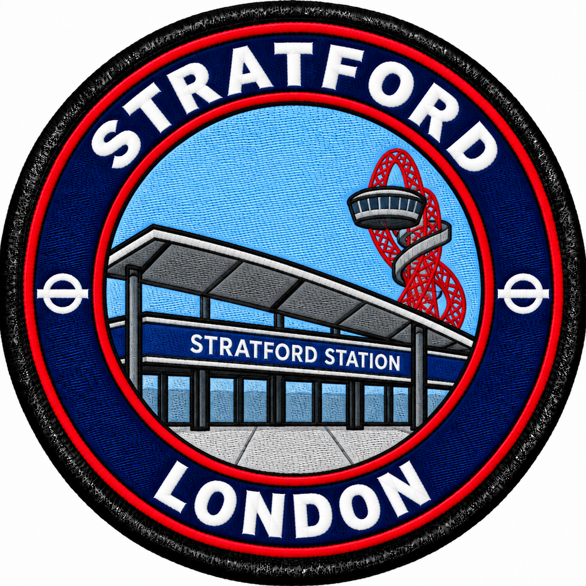 Round 80mm embroidered patch showing Stratford station with a red looping tower behind it, framed by STRATFORD and LONDON lettering, finished with a black border.