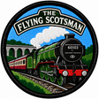 Round 80mm embroidered patch showing a green steam locomotive numbered 60103 pulling red and cream carriages, with a stone viaduct and THE FLYING SCOTSMAN lettering, finished with a black border.