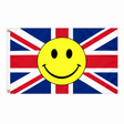 Red white and blue Union Jack flag with a large yellow smiley face in the centre