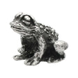 English-made pewter toad figurine ornament, front three-quarter view with large eyes and textured skin