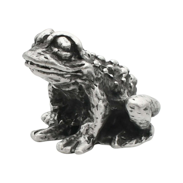 English-made pewter toad figurine ornament, front three-quarter view with large eyes and textured skin