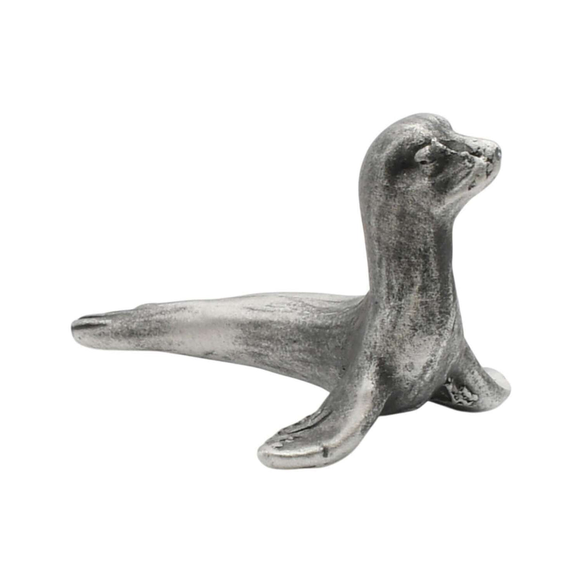 English-made pewter sea lion figurine ornament with raised head and outstretched front flippers, side view