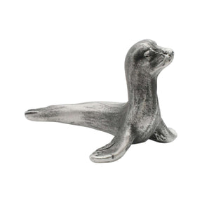 English-made pewter sea lion figurine ornament with raised head and outstretched front flippers, side view