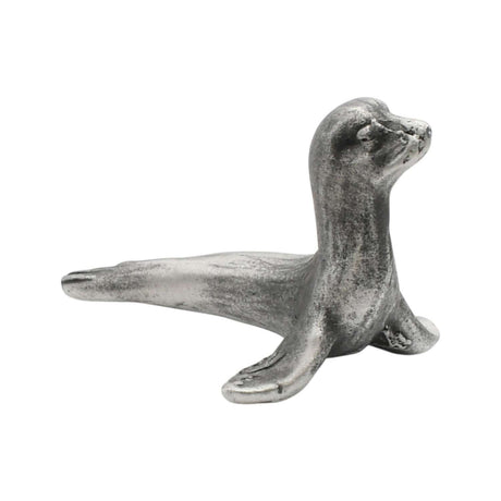 English-made pewter sea lion figurine ornament with raised head and outstretched front flippers, side view