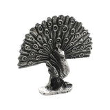 English-made pewter peacock figurine ornament, front view showing a fully fanned tail with decorative eye feather patterns