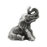 English-made pewter sitting elephant figurine ornament with trunk raised and curled, first three-quarter view