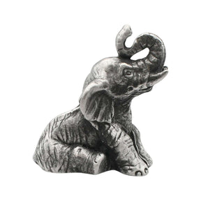 English-made pewter sitting elephant figurine ornament with trunk raised and curled, first three-quarter view