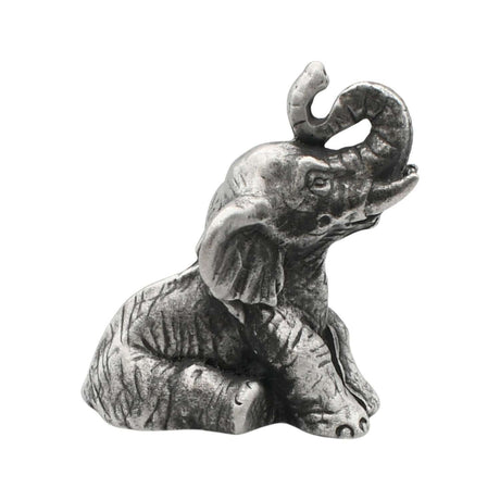 English-made pewter sitting elephant figurine ornament with trunk raised and curled, first three-quarter view