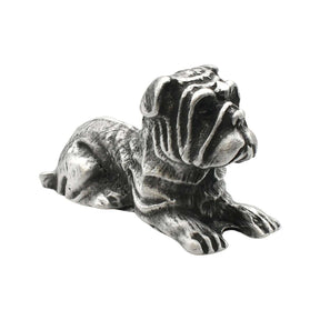 English-made pewter bulldog figurine ornament lying down with wrinkled face and outstretched paws, first side view