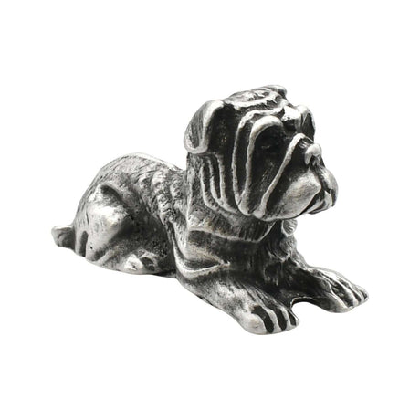English-made pewter bulldog figurine ornament lying down with wrinkled face and outstretched paws, first side view
