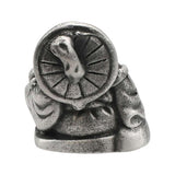 English-made pewter Buddha ornament, rear view showing a round decorative detail and sculpted robes