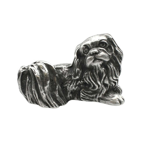 English-made pewter Pekingese dog figurine ornament lying down, with long flowing fur and a curled tail