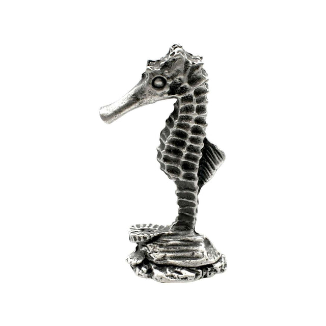 English-made pewter seahorse figurine ornament, side view showing long snout, upright ridged body and textured seabed base