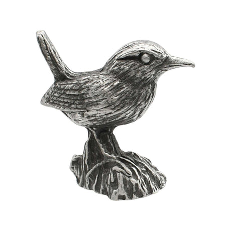 English-made pewter wren ornament perched on tree stump, first side showing raised tail and detailed wing feathers