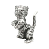 Back view of English-made pewter begging cat ornament showing textured fur and curved tail