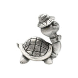 Back of English-made pewter comical turtle figurine showing the patterned shell and hat