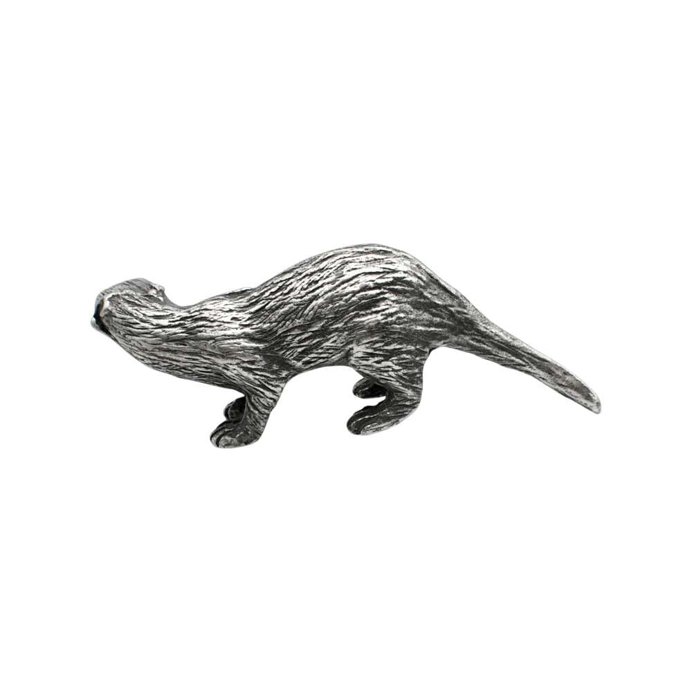 Opposite side of English-made pewter otter ornament with sculpted fur and long tapering tail