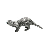 Opposite side of English-made pewter otter ornament with sculpted fur and long tapering tail