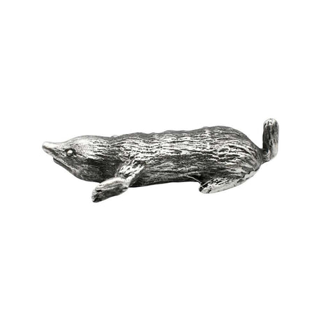 Side view of English-made pewter mole figurine showing its elongated body, digging paws and short tail