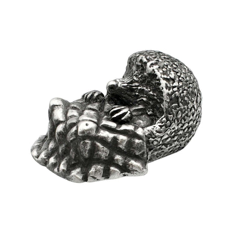 English-made pewter hedgehog with blanket ornament, curled hedgehog with textured spines and folded blanket, first angle