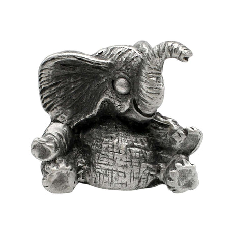 English-made pewter baby elephant figurine with raised trunk, large ears and feet out in front, front view