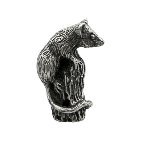 English-made pewter dormouse figurine perched on tree stump with little paws and curled tail, first side view