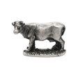 English made pewter cow figurine ornament with horns standing on grassy base, first side XCSORN083