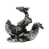 English-made pewter dragon in egg figurine ornament opposite view showing cracked eggshell and dragon wings XCSORN090