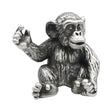 English made pewter seated chimpanzee figurine ornament with raised hand, front view XCSORN094