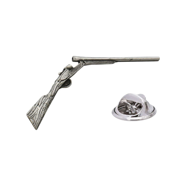 Antique silver-coloured shotgun lapel pin badge showing a traditional sporting shotgun with butterfly clasp