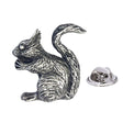 Antique silver-coloured squirrel lapel pin badge with curled bushy tail and butterfly fastening
