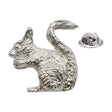 Shiny bright silver-coloured squirrel lapel pin badge with curled bushy tail and butterfly fastening