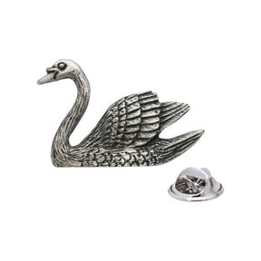 Antique silver-coloured swan lapel pin badge with curved neck, detailed wings and butterfly clasp