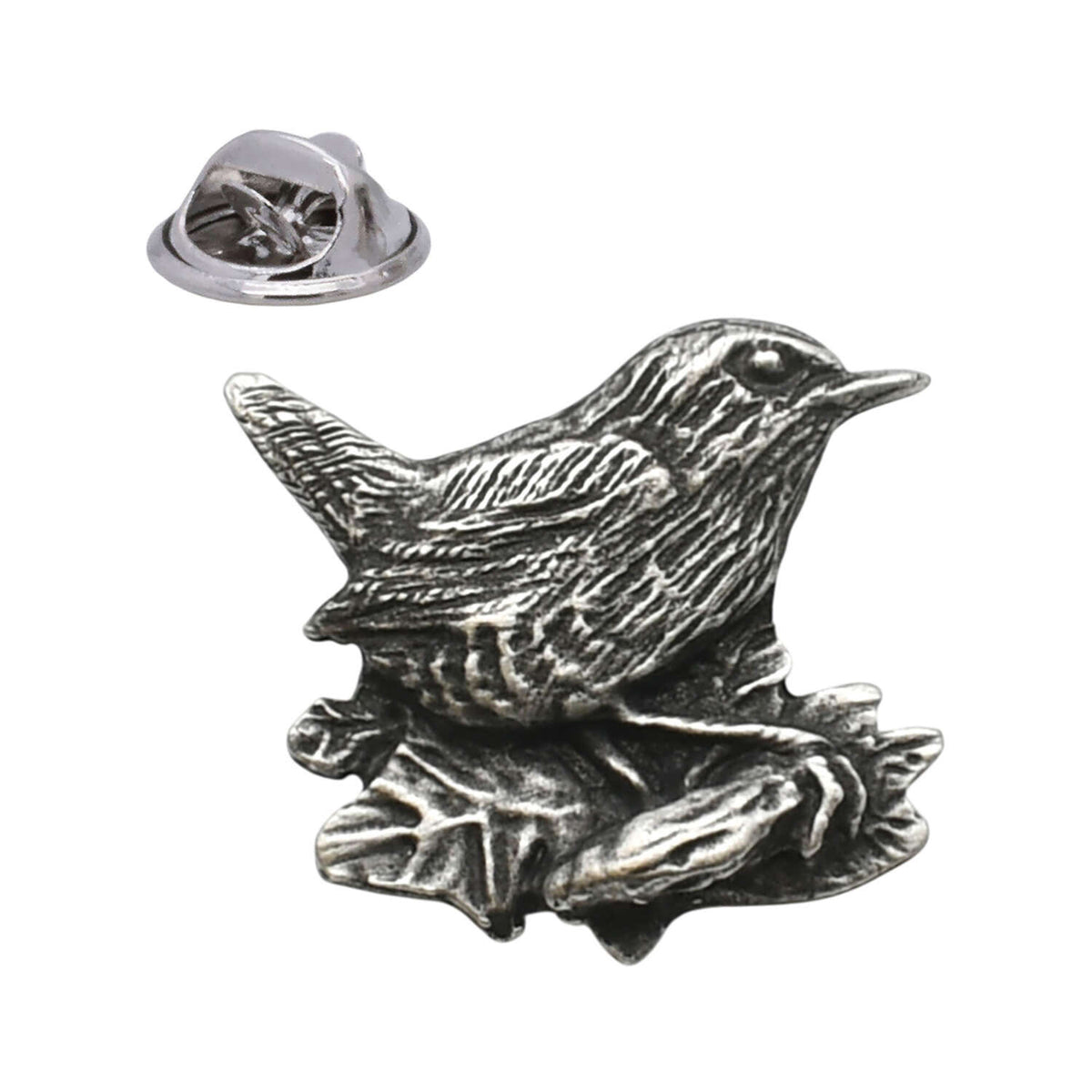 Antique silver-coloured wren bird lapel pin perched on a branch with butterfly clasp