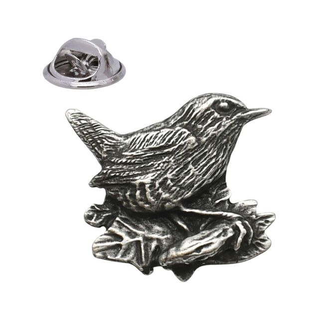 Antique silver-coloured wren bird lapel pin perched on a branch with butterfly clasp