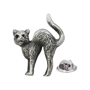Antique silver-coloured cat lapel pin badge with arched back, raised tail and butterfly clasp