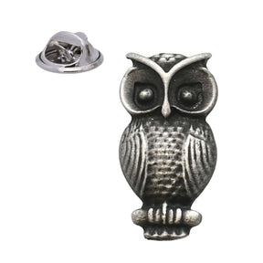 Antique silver-coloured small owl lapel pin badge with large round eyes and butterfly clasp