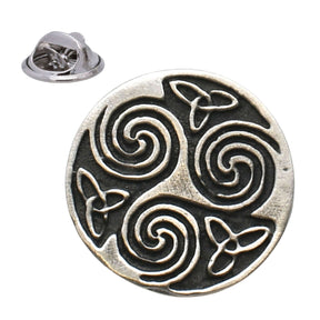 Antique silver-coloured circular Celtic triskele lapel pin with three spiral motifs, knotwork and butterfly clasp