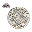 Bright silver-coloured circular Celtic triskele lapel pin with three spiral motifs and butterfly clasp