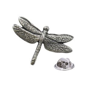 Antique silver-coloured dragonfly lapel pin with four textured wings, segmented body and butterfly clasp