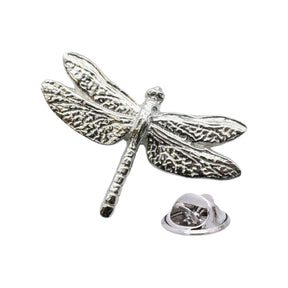 Shiny bright silver-coloured dragonfly lapel pin with four patterned wings, segmented body and butterfly clasp