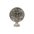 Freestanding Green Man pewter altar ornament with face surrounded by oak leaves and acorns, on display pedestal
