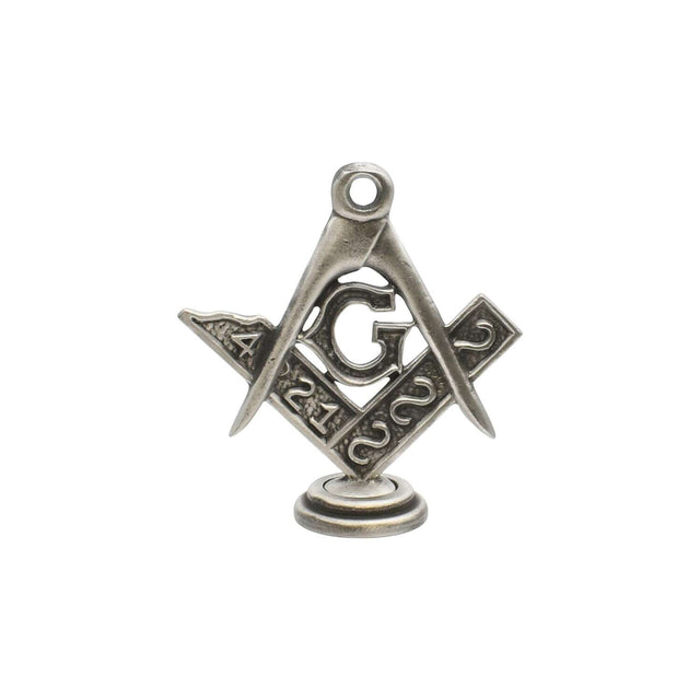 Freestanding Masonic Square and Compasses with G pewter ornament on round pedestal against white background