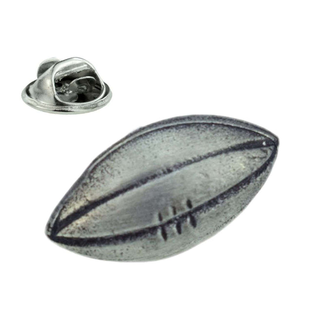 Antique silver-coloured rugby ball lapel pin badge with raised seams, stitching and butterfly clasp