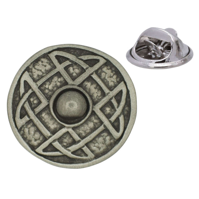 Antique silver-coloured circular Celtic shield lapel pin with interwoven knotwork, raised centre and butterfly clasp