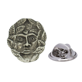 Antique silver-coloured Green Man face lapel pin surrounded by foliage with butterfly clasp
